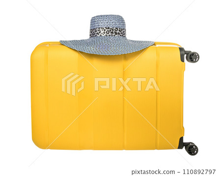 Travel yellow suitcase with blue hat isolated on white background. Plastic travel suitcase with hat. 110892797