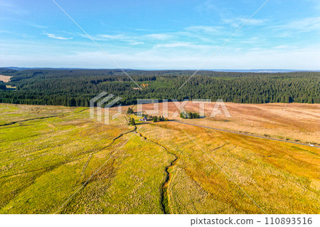 Blatna irrigation canal in the middle of autumn landscape at Ryzovna, Ore Mountains, Czech: Krusne hory, Czechia. Aerial view from drone. Blatna irrigation canal in the middle of autumn landscape at Ryzovna, Ore Mountains, Czech: Krusne hory, Czechia. Aerial view from drone. 110893516