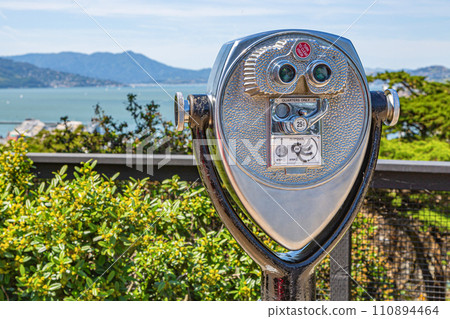 Coin operated binoculars looking out over San Francisco City 110894464