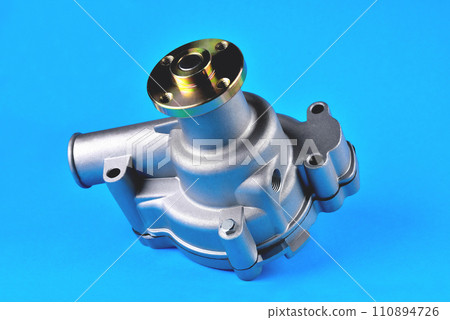 Engine cooling pump, engine coolant pump for truck, blue background, close-up 110894726