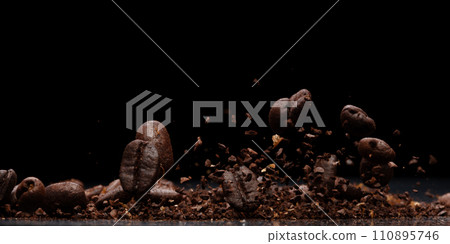 Coffee powder fly explosion, Coffee crushed ground float pouring, wave like smoke smell. Coffee ground powder splash throwing in mid Air. Black background Isolated selective focus blur 110895746