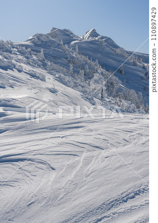Mt. Kengamine in winter seen from the mountain trail heading from Mt. Buson to Mt. Kengamine 110897429