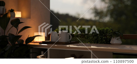 A modern and comfortable home relaxation area on a balcony with a nature view in the evening. A modern and comfortable home relaxation area on a balcony with a nature view in the evening. 110897500