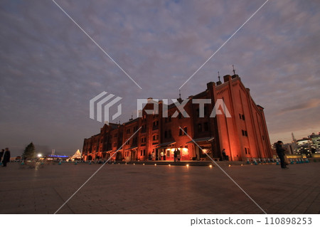 Red brick warehouse and silhouette 110898253