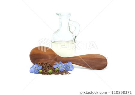 Flax blossom and heap of linseed isolated on white 110898371
