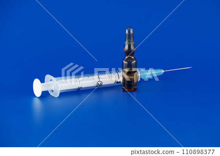 Quintessential medical tools on blue surface 110898377