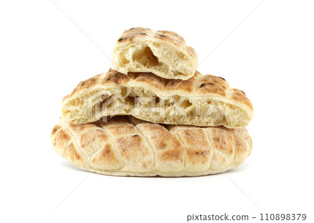 Pita flat-bread toasted of a grid pattern over white 110898379