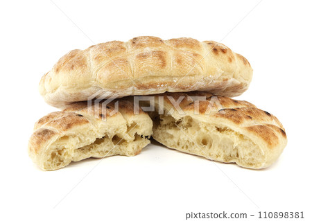 Round pita flat-bread on a white background Round pita flat-bread on a white background 110898381