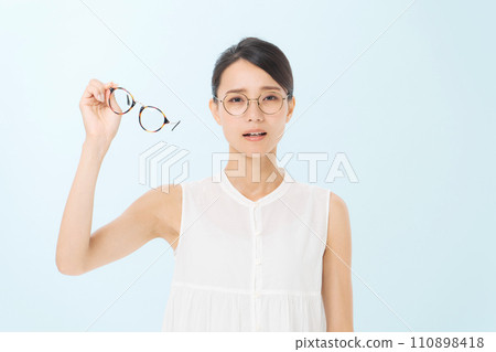 A woman wearing glasses A woman wearing glasses 110898418