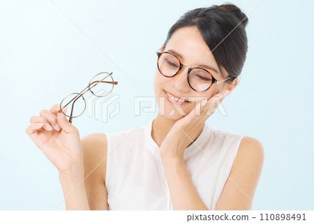 A woman wearing glasses A woman wearing glasses 110898491