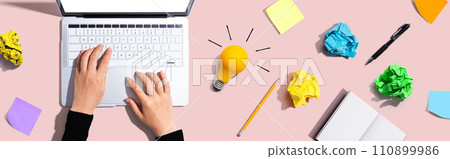 Laptop Computer with a light bulb 110899986