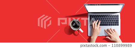 Person using a laptop computer Person using a laptop computer 110899989