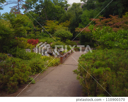 Japanese park in Vienna on a summer day. Zetagaya Park is small, quiet Japanese garden with cherry trees and fish pond, open to public from April to October. 110900370