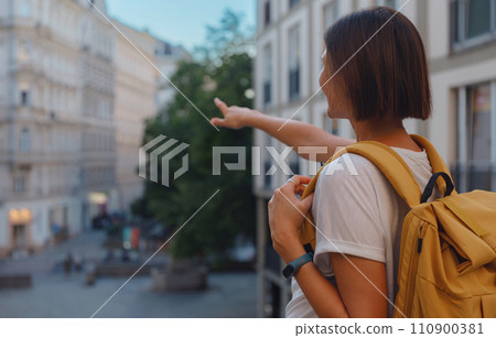Female tourist traveling in Austria, capital city Vienna. summer female solo trip to Europe, happy young woman walking on european street. Female tourist traveling in Austria, capital city Vienna. summer female solo trip to Europe, happy young woman walking on european street. 110900381