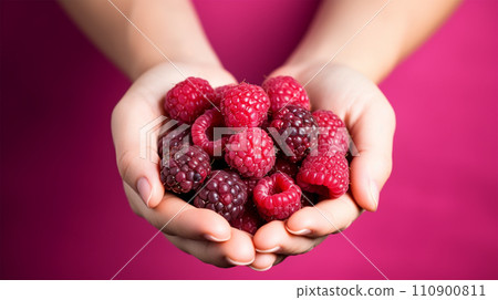 woman's hand holding raspberries woman's hand holding raspberries 110900811