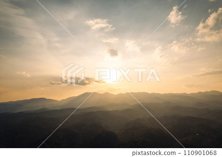 View of mountains and trees in the evening,in the summer View of mountains and trees in the evening,in the summer 110901068