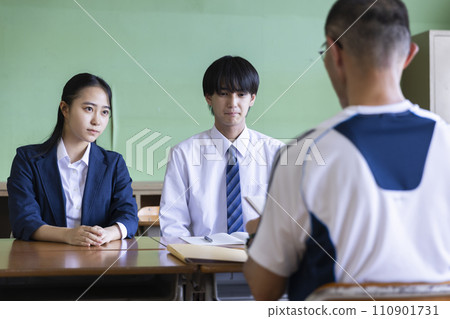 Students having a three-way interview at school Students having a three-way interview at school 110901731