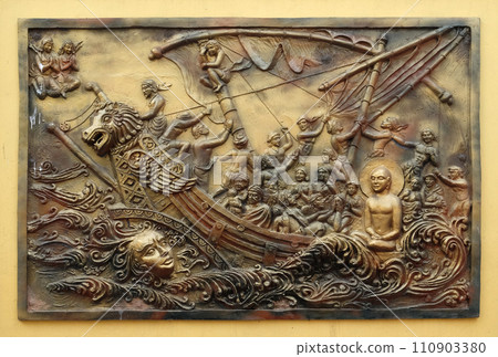 Soul itself is the strongest power; Sudamstra, a serpent-prince, creates a heavy storm in the river, but fails, Street bass relief on the wall of Jain Temple in Kolkata 110903380