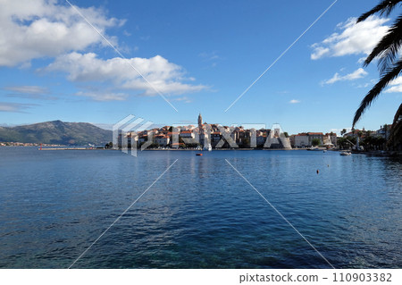 Seafront view at picturesque medieval Dalmatian town Korcula, Croatian culture and historic destination Seafront view at picturesque medieval Dalmatian town Korcula, Croatian culture and historic destination 110903382