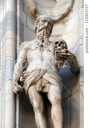 Statue of Saint on the facade of the Milan Cathedral, Duomo di Santa Maria Nascente, Milan, Lombardy, Italy Statue of Saint on the facade of the Milan Cathedral, Duomo di Santa Maria Nascente, Milan, Lombardy, Italy 110903527