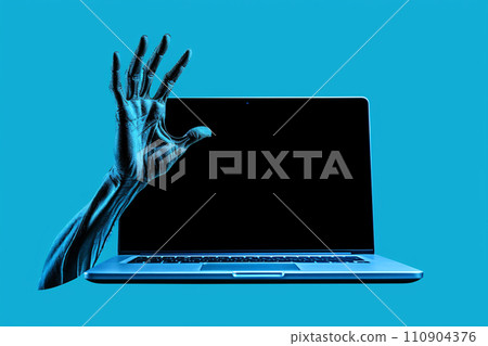 A hand sticking out of a laptop, an image of horror or viruses A hand sticking out of a laptop, an image of horror or viruses 110904376