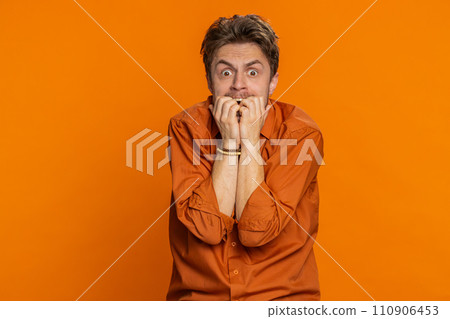 Scared fearful depressed Caucasian man suffering phobia anxiety disorder expresses fear stress panic Scared fearful depressed Caucasian man suffering phobia anxiety disorder expresses fear stress panic 110906453