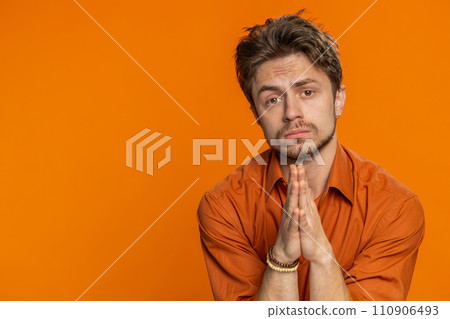 Caucasian sad man praying making wish, asking hopeful help, begging apology, meditation, imploring Caucasian sad man praying making wish, asking hopeful help, begging apology, meditation, imploring 110906493