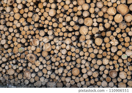 Abstract photo pile natural wood background dry chopped firewood logs ready for winter 110906551