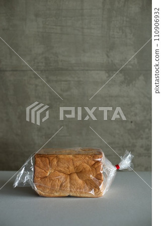 A loaf of bread in a plastic bag A loaf of bread in a plastic bag 110906932