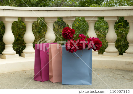 Flowers in paper, gift bags, on the street. 110907515