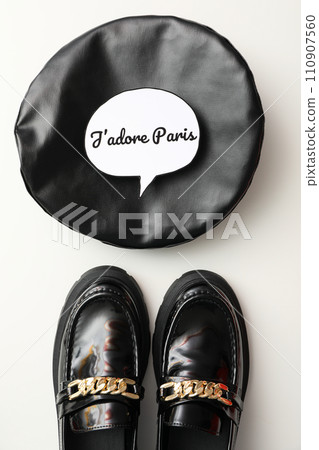 French beret, loafers and expressions, concept of learning French. French beret, loafers and expressions, concept of learning French. 110907560