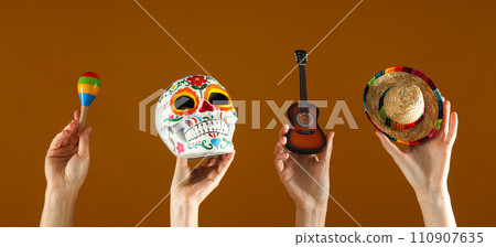 Mexican symbols in the hands of women. Mexican symbols in the hands of women. 110907635