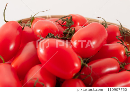 Ripe cherry tomatoes Aiko colander close-up 110907760