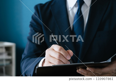 Businessman signing a contract Businessman signing a contract 110907861