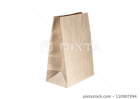 Recyclable craft paper bag for purchases, gifts and takeaway food mock up on white background. Environmentally friendly than single-use plastic bags 110907894