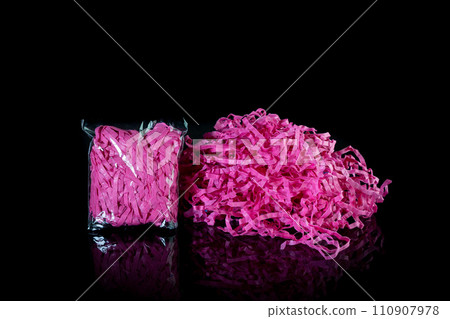 Closeup decorative Shredded color craft tissue paper black background Closeup decorative Shredded color craft tissue paper black background 110907978