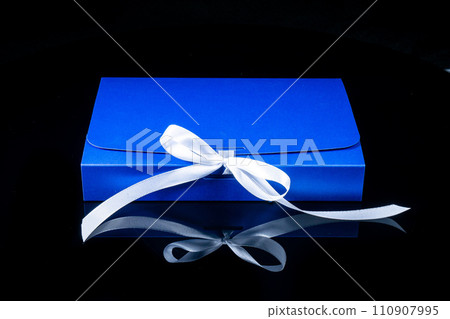 Man gift concept. gift box with luxury bow on dark background. Horizontal with copy space. 110907995