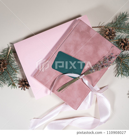 Beautiful gift pink cardboard box stars Christmas balls on beige background top view Flat lay. New Year presents Festive decorations 2024 celebration. Merry Christmas Happy Holidays card Beautiful gift pink cardboard box stars Christmas balls on beige background top view Flat lay. New Year presents Festive decorations 2024 celebration. Merry Christmas Happy Holidays card 110908027
