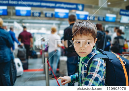 sad caucasian boy in airport with backpack and suitcase. Travelling concept sad caucasian boy in airport with backpack and suitcase. Travelling concept 110908076