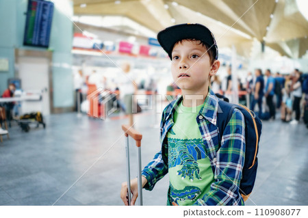 cute caucasian boy in airport with backpack and suitcase. Travelling concept cute caucasian boy in airport with backpack and suitcase. Travelling concept 110908077