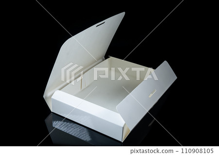 Blank package mockup. White paper box on black plaster background. Top view. 110908105