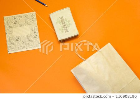 Top view brown paper shopping bag on colourful background, Mock-up of blank brown paper shopping bag and copy space. Flat lay. 110908190