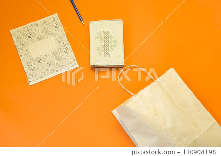 Top view brown paper shopping bag on colourful background, Mock-up of blank brown paper shopping bag and copy space. Flat lay. Top view brown paper shopping bag on colourful background, Mock-up of blank brown paper shopping bag and copy space. Flat lay. 110908198