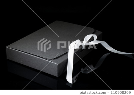 Man gift concept. gift box with luxury bow on dark background. Horizontal with copy space. 110908209