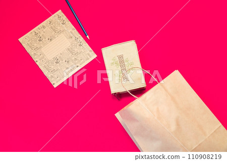 Top view brown paper shopping bag on colourful background, Mock-up of blank brown paper shopping bag and copy space. Flat lay. 110908219