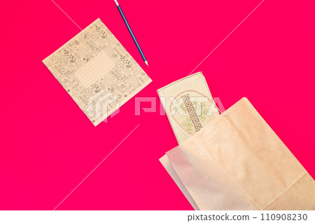 Top view brown paper shopping bag on colourful background, Mock-up of blank brown paper shopping bag and copy space. Flat lay. 110908230
