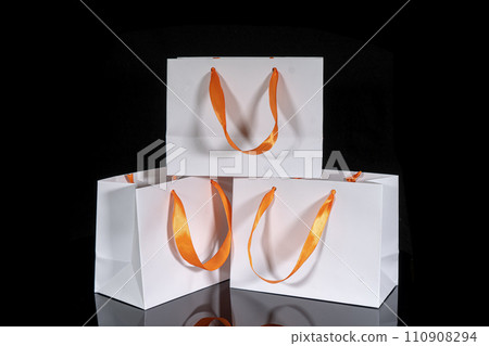 Set of paper bags for shopping on black background. Mockup for design Set of paper bags for shopping on black background. Mockup for design 110908294
