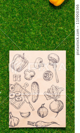 a paper bag lies on the green grass with fruits and vegetables around, moss, mock up a paper bag lies on the green grass with fruits and vegetables around, moss, mock up 110908366