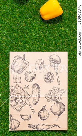 a paper bag lies on the green grass with fruits and vegetables around, moss, mock up a paper bag lies on the green grass with fruits and vegetables around, moss, mock up 110908370