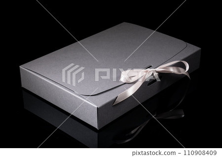 Man gift concept. gift box with luxury bow on dark background. Horizontal with copy space. 110908409